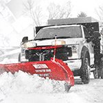 Plow truck plowing snow